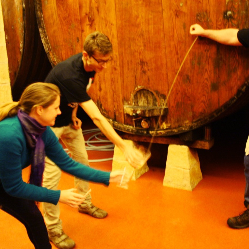 cider pouring from a barrel