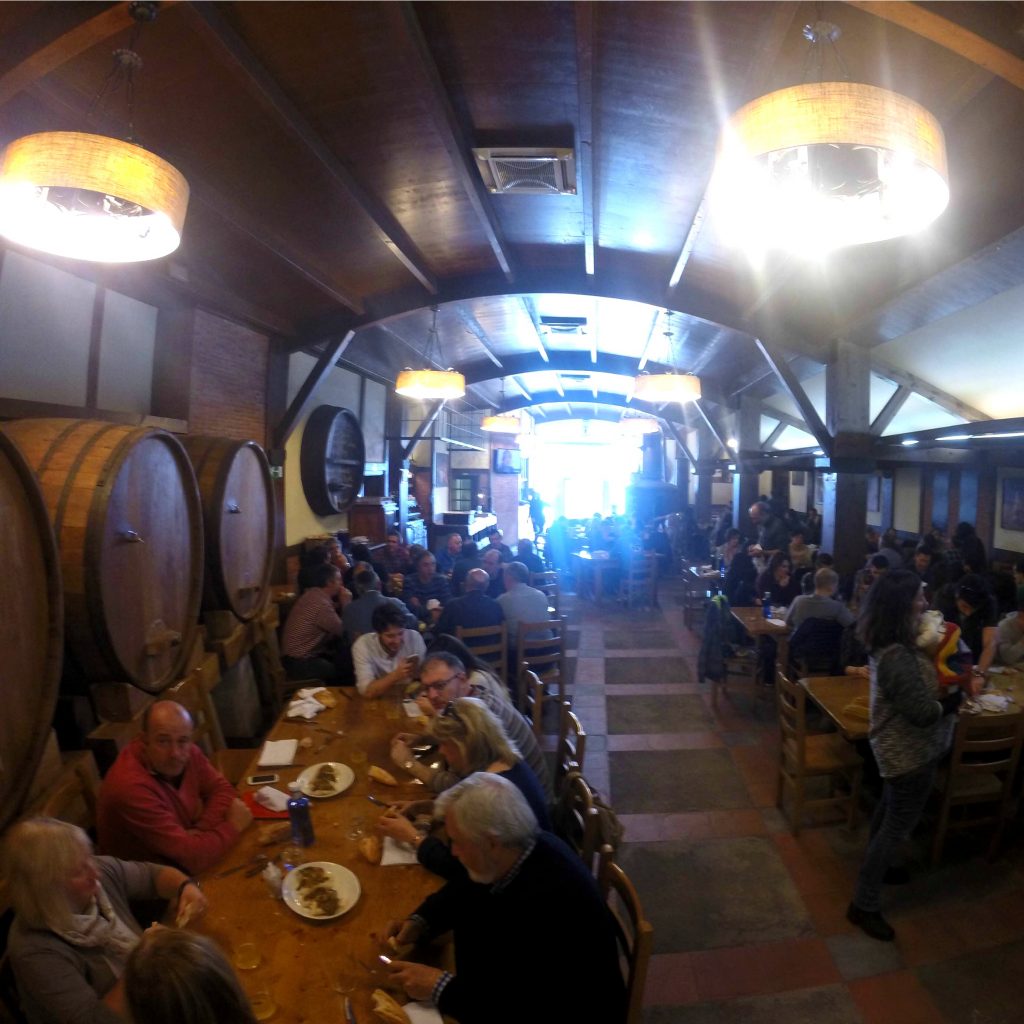 crowd of people inside a cider house