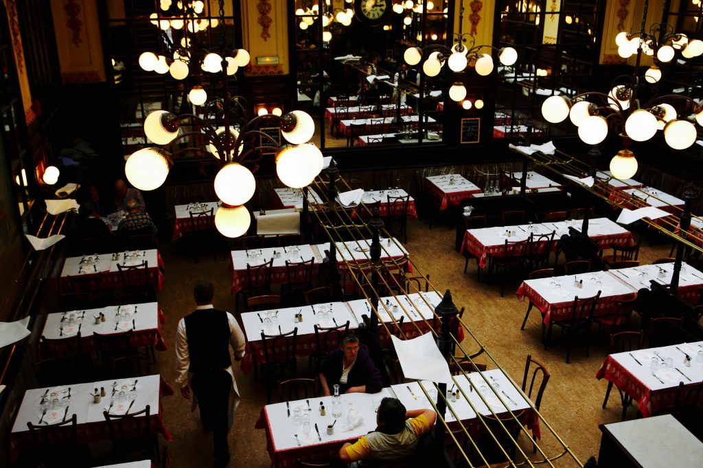 Rows of tables in a dining room in Paris