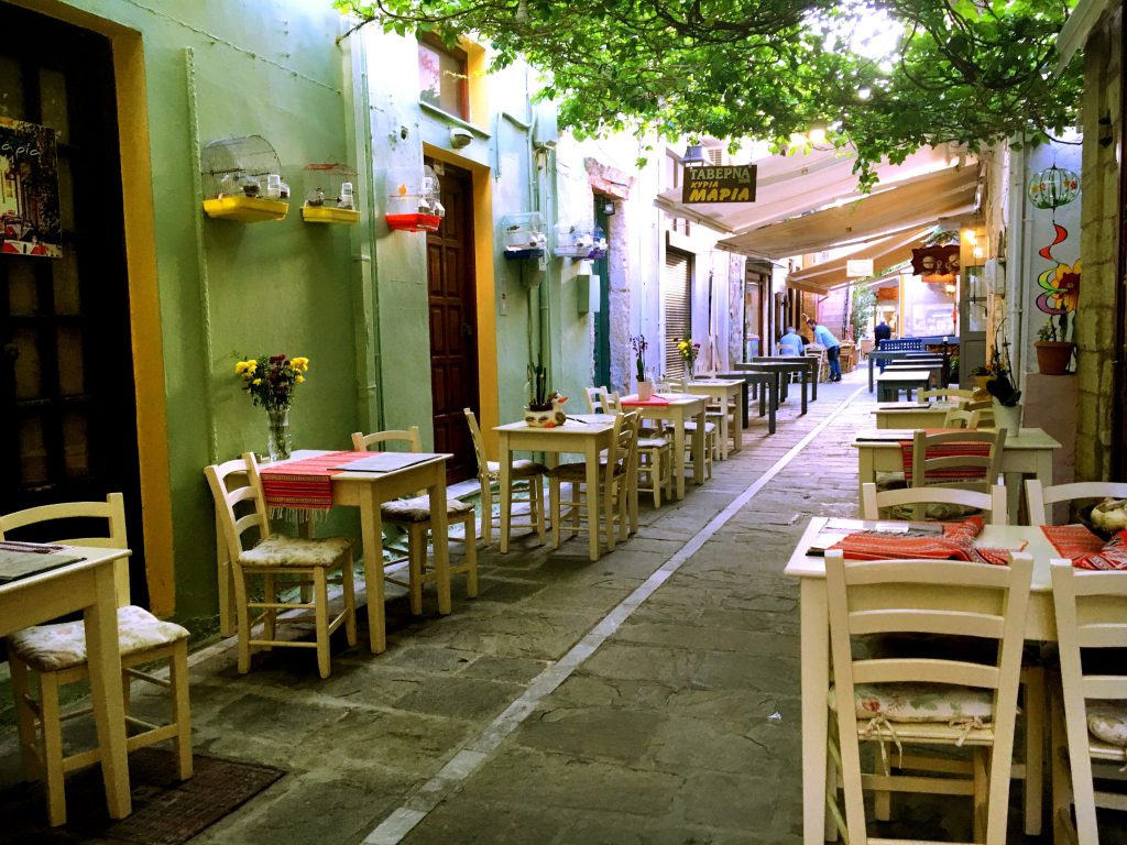 tables and chairs at a Crete cafe