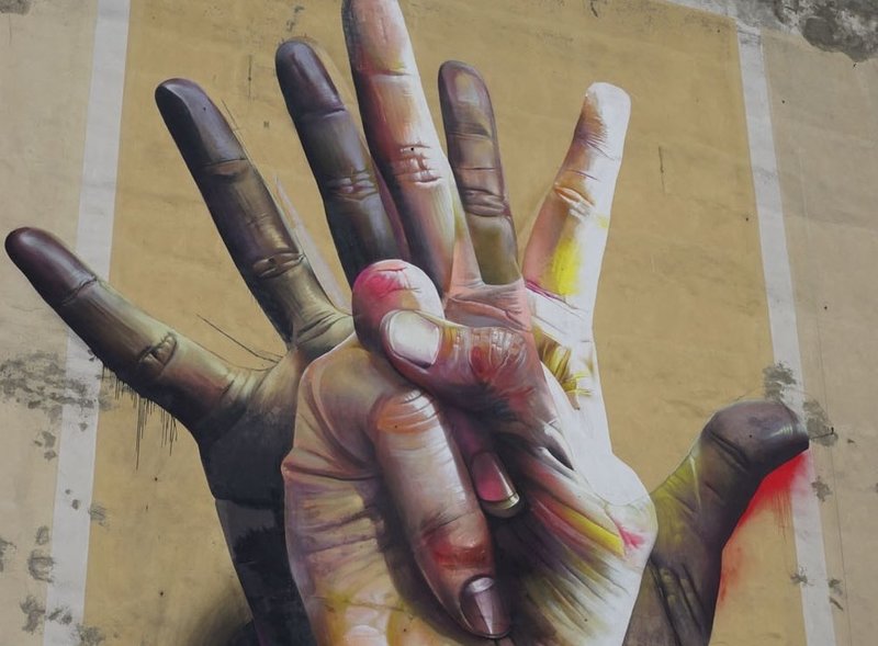 street art of hands in Berlin