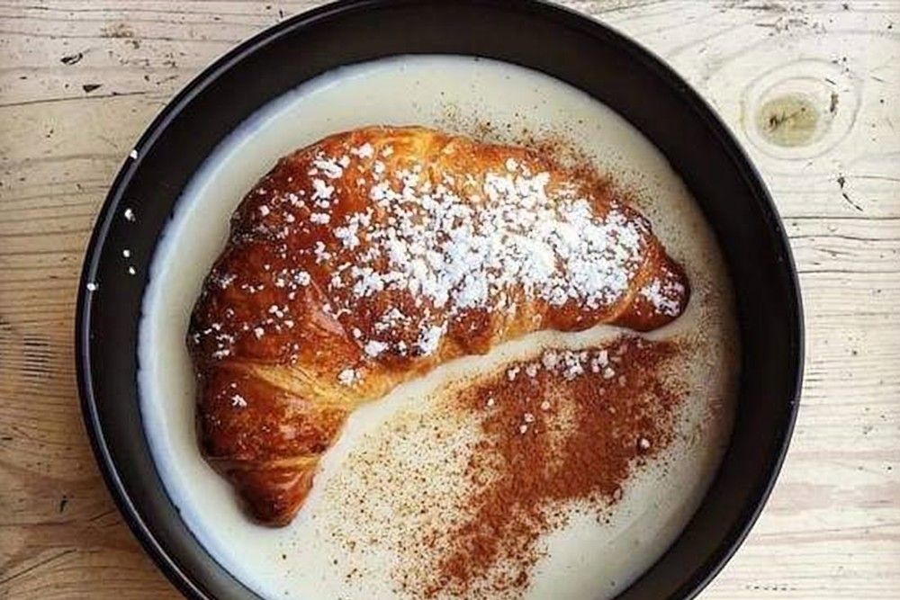 croissant in a bowl of cream