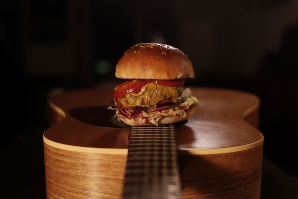 guitar with a burger on top