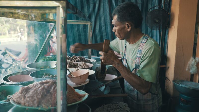 Street food vendor preparing his ingredients